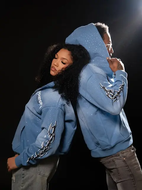 Two models back to back in Written In Stone hoodies